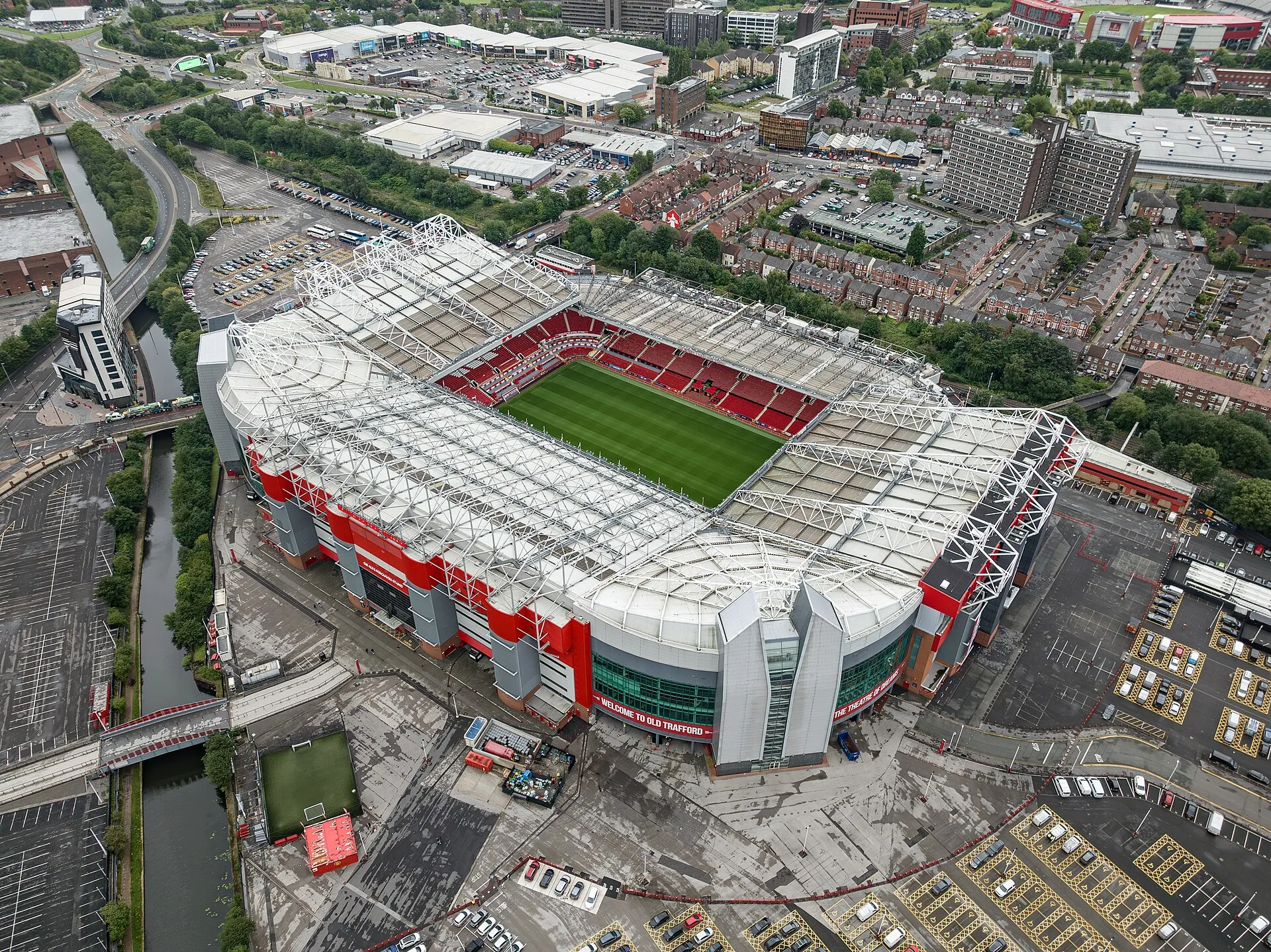 Aerial view of Old Trafford stadium in Manchester with the pitch and full bowl visible